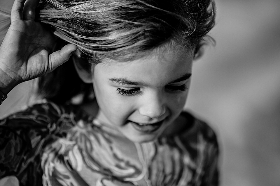 black and white picture of girl with wind and hair