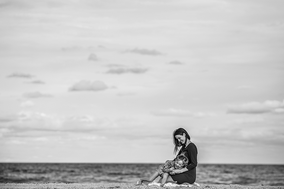mom with daughter on beach 