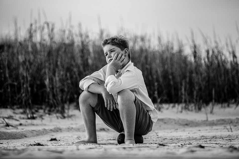 boy sitting on the beach