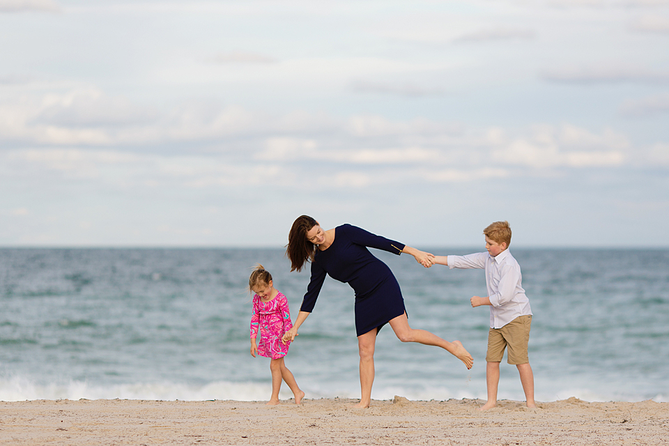 mom with kids on the beach