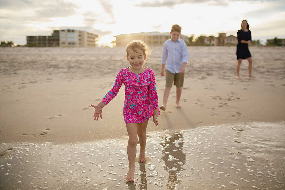 girl running into the water