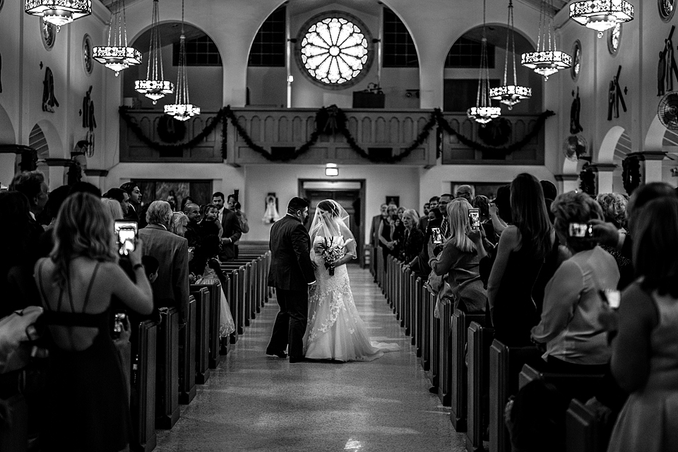 I love how the groom met the bride half way down the isle at St. Catholics Church in Vero Beach FLorida