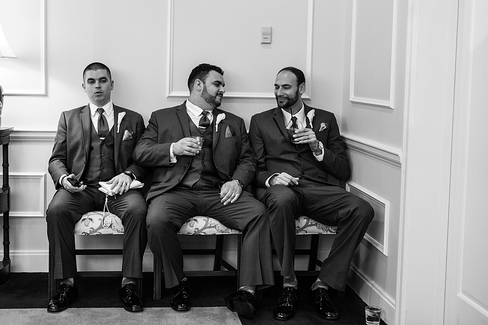 Groomsmen waiting to enter the reception at Oak Harbor in Vero Beach Florida