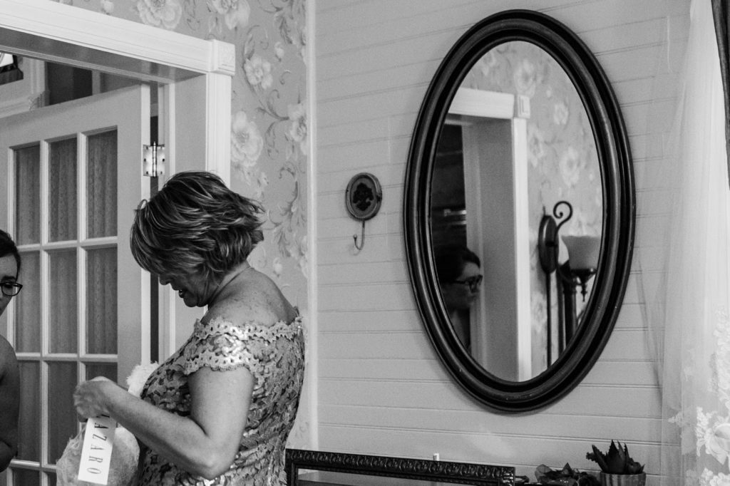 bride stepping into the wedding gown