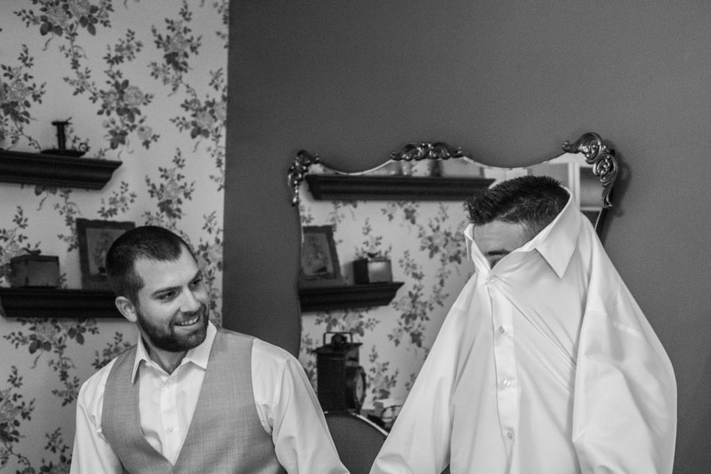 groomsman stuck in shirt