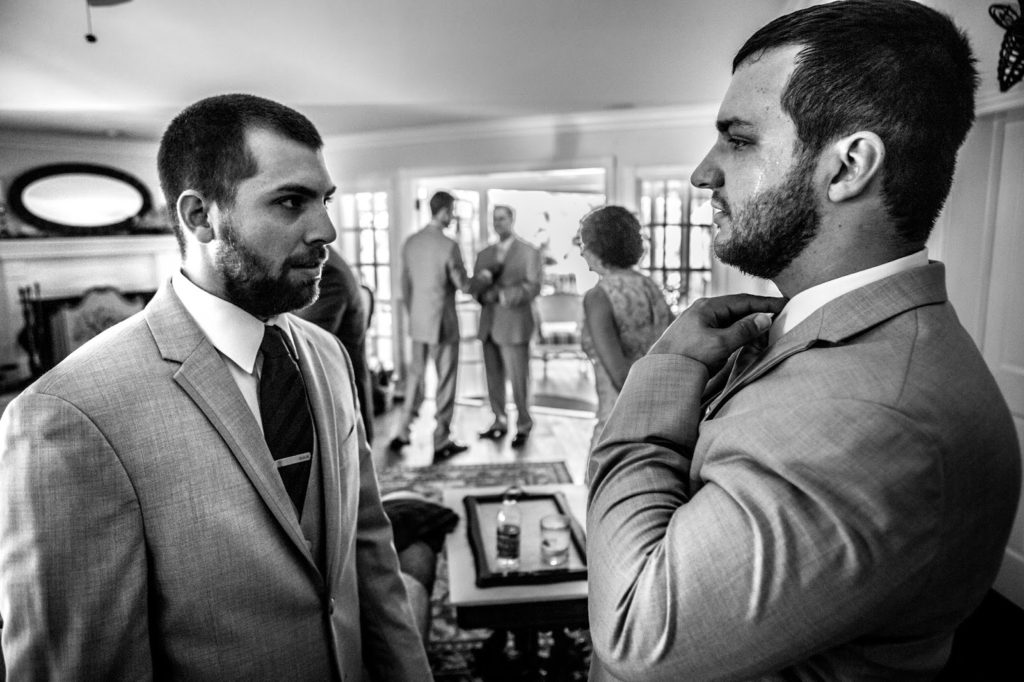 Groom talking with his best man