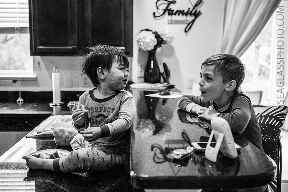 sweet moment between brothers eating breakfast