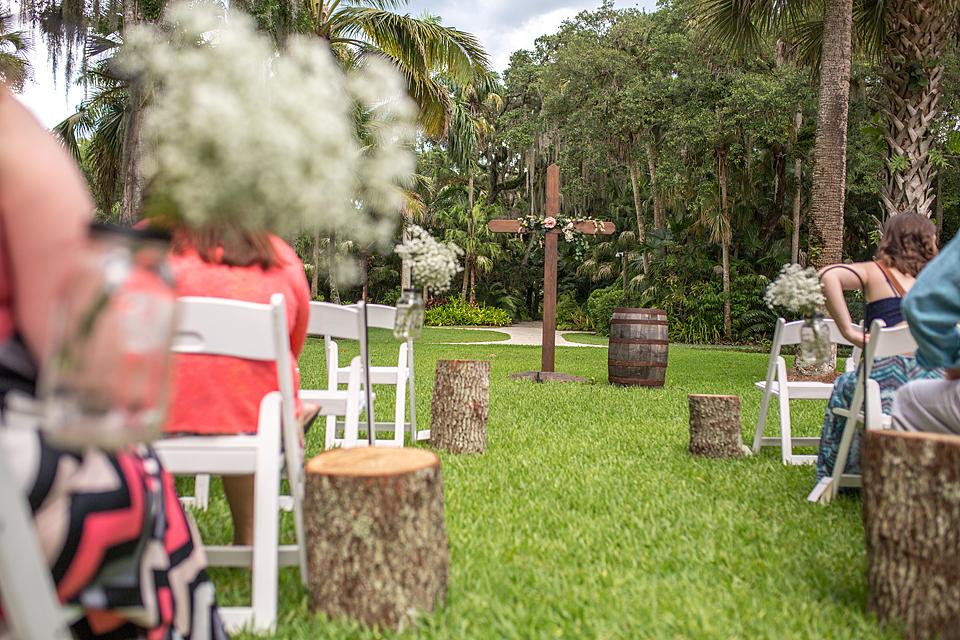wooden cross ceremony decoration at a garden wedding in vero beach florida