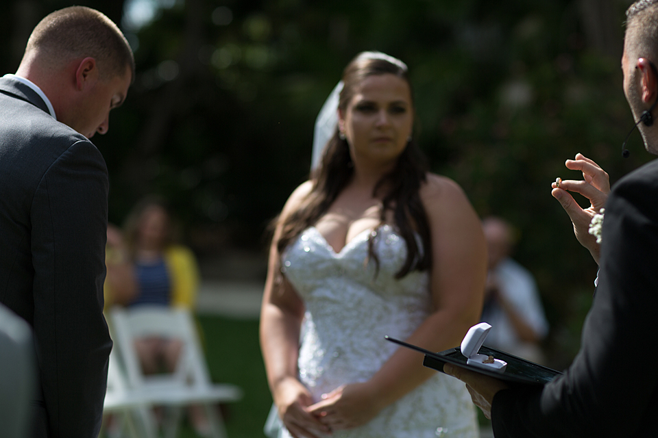 officiant holds up ring during ceremony at mckee gardens vero beach florida