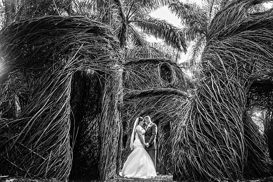 Stickwork huts in vero beach florida wedding at mckee gardens black and white photo
