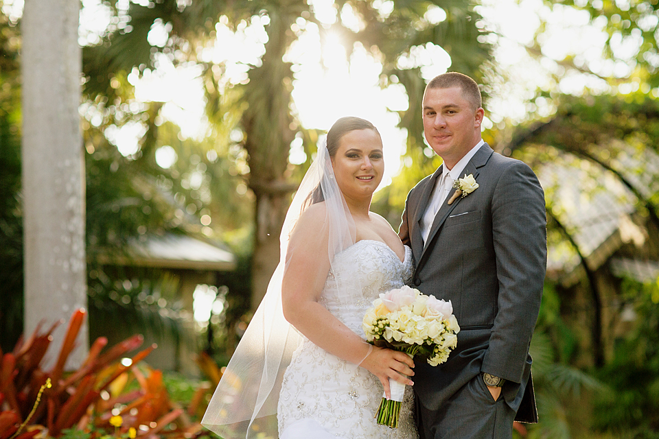 Bride and Groom formal photo holding a bouquet standing in mckee gardens