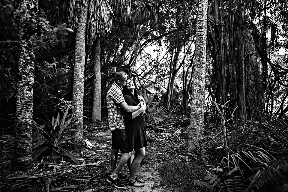 black and white photo of couple in a tropical forest in south flordia 