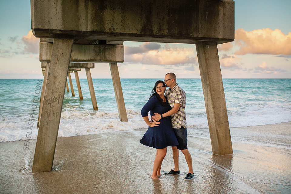 engagment couple under the pier in vero beach florida