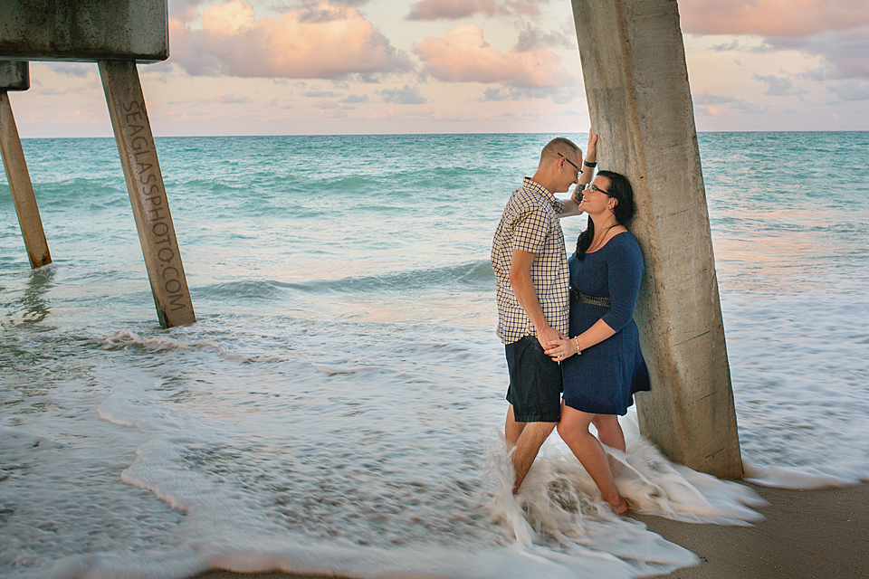 enagement photo under the vero beach pier at sunset