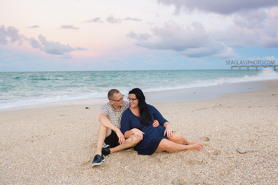 couple sitting at the beach in vero at sunset