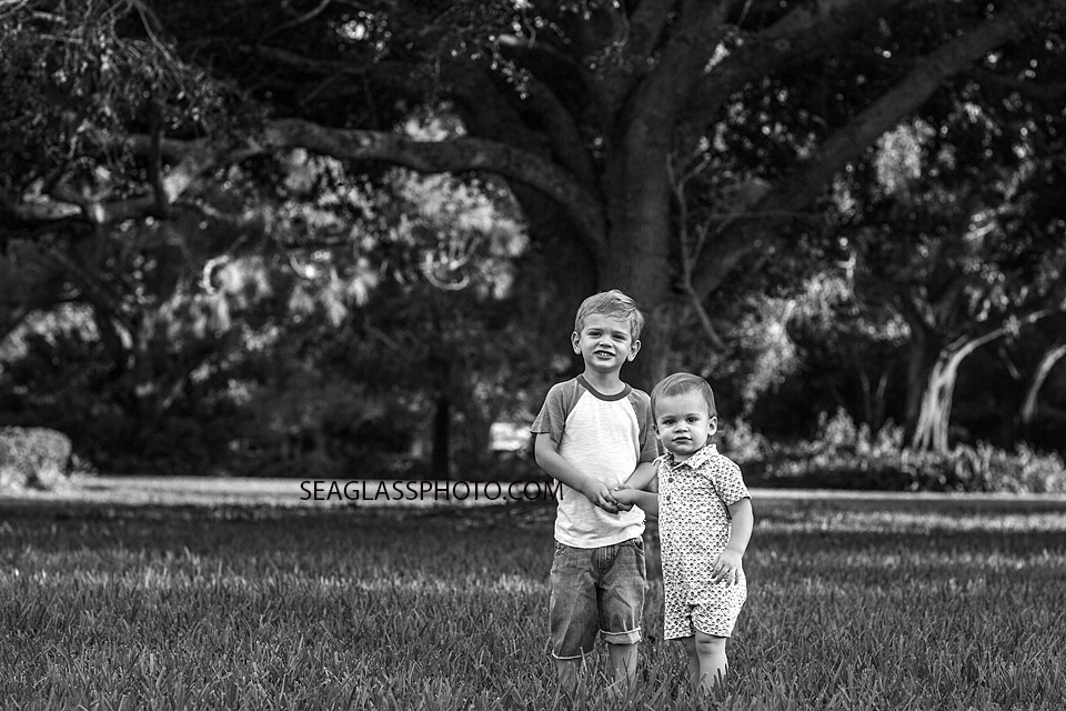 Black and White Brothers Playing in Grass Vero Beach Florida Photo