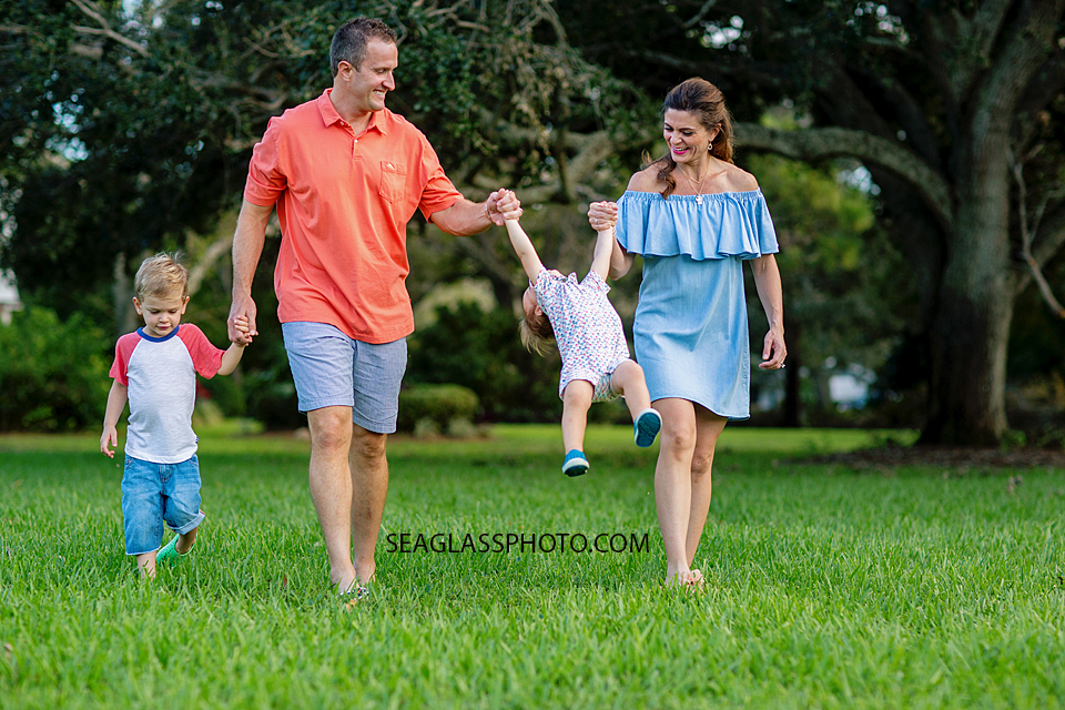 Family walking through the park in vero beach florida photo 