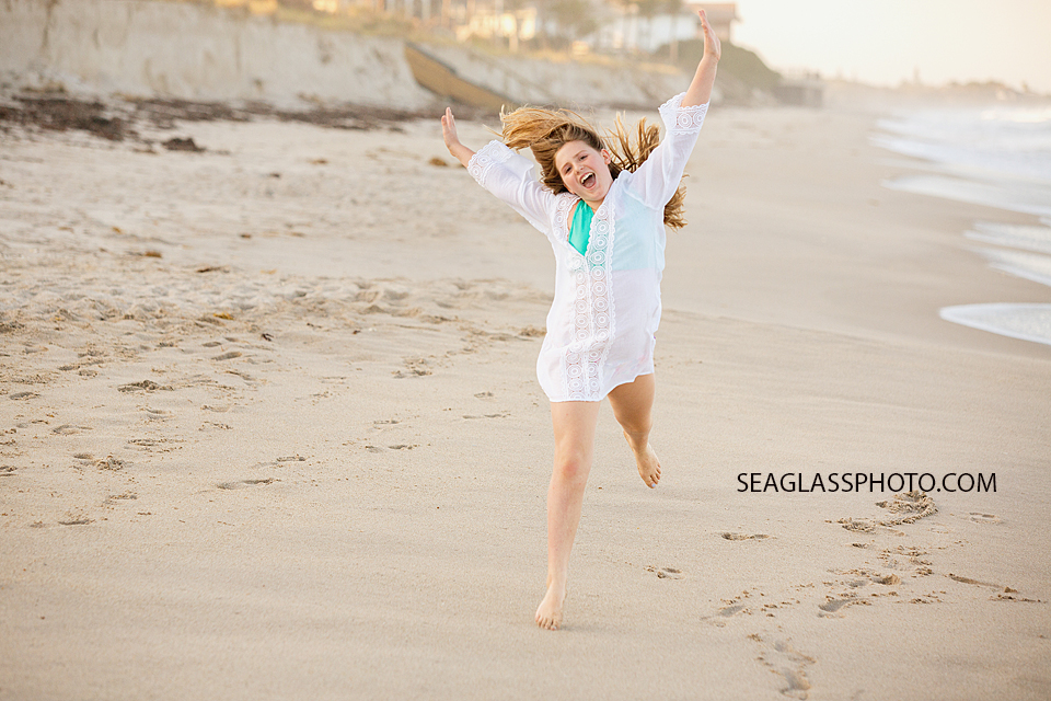 girl running and jumping on the beach Windsor Vero Beach Flordida Family Photography