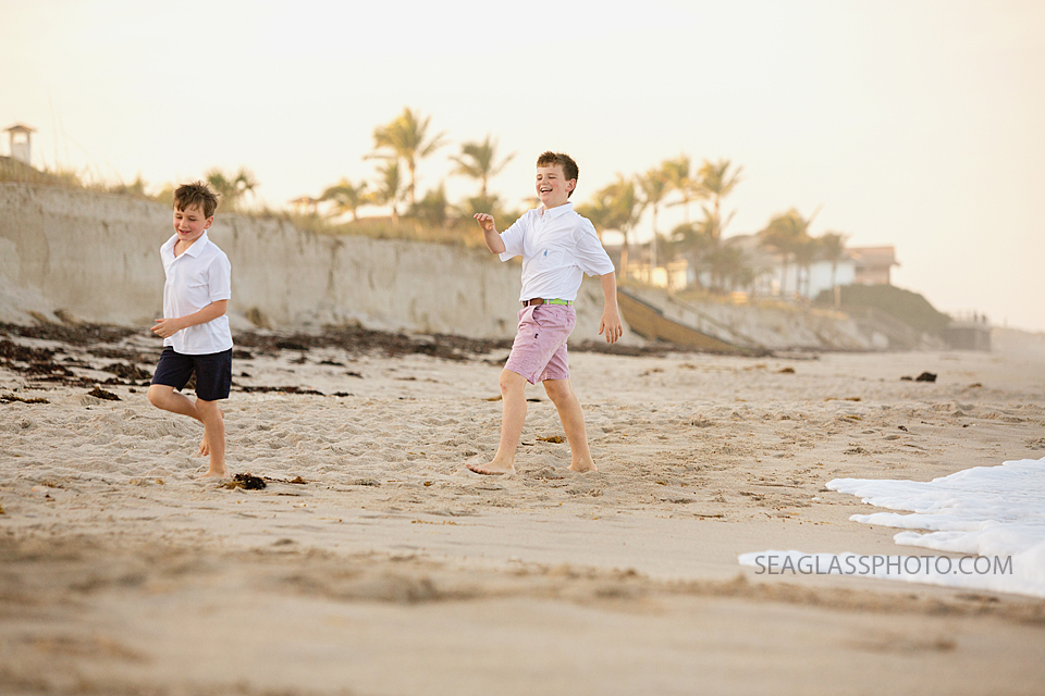 brothers chasing each other on the beach Windsor Vero Beach Flordida Family Photography