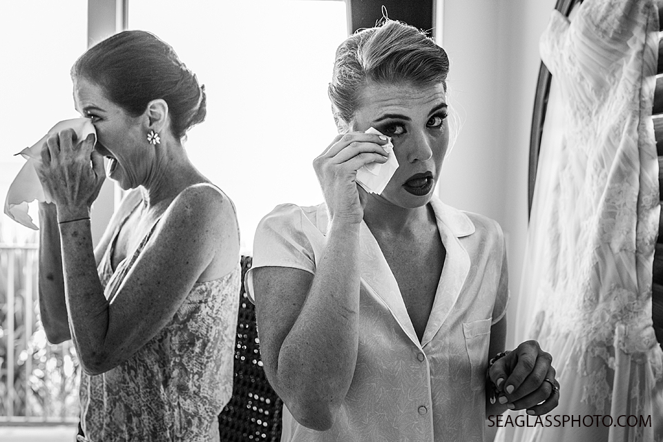 black and white photo of mother and daughter crying on her wedding day