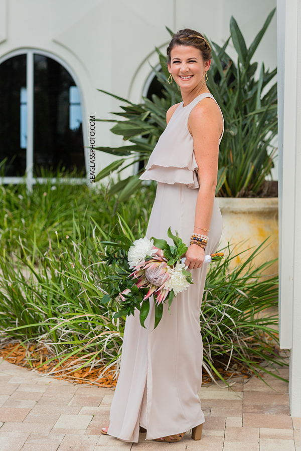 Wedding at Costa D'Este bridesmaid holding bouquet Vero Beach Florida