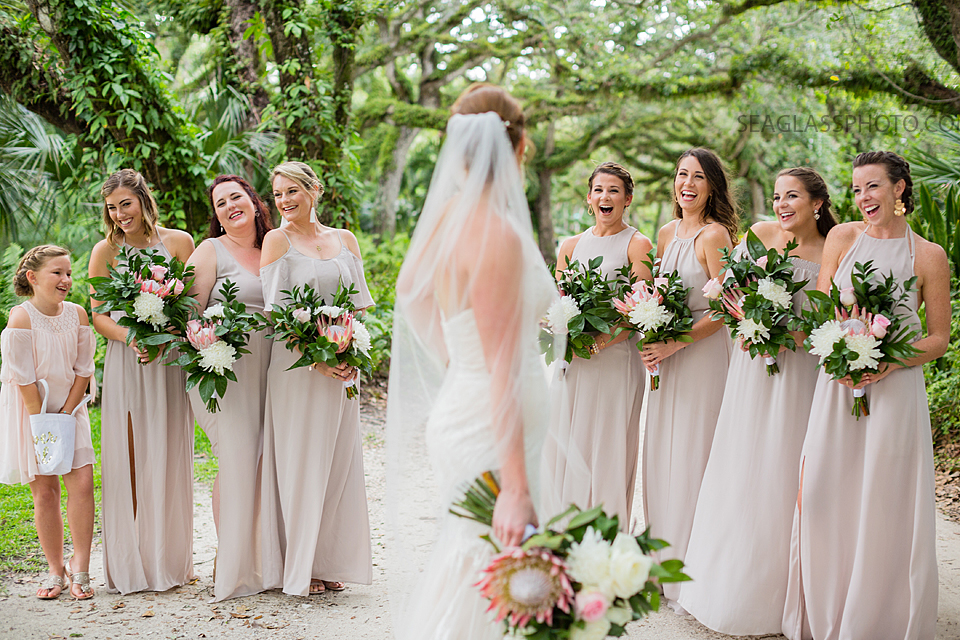Bridal party standing under the oaks in Vero Beach Florida