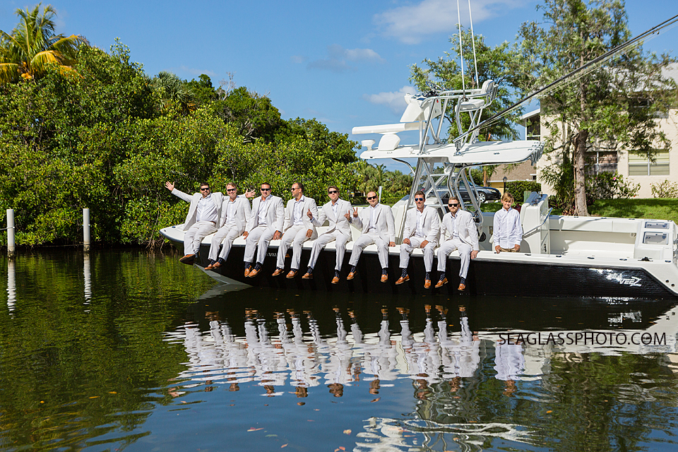 groomsmen hanging out on a boat in Vero Beach Fl