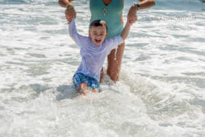 mom holding son in the ocean in Vero Beach Florida