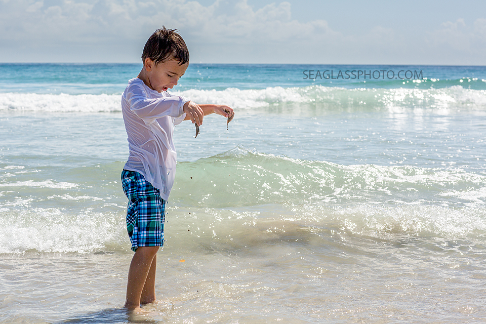 boy playing with the sand at Ft. Pierce State