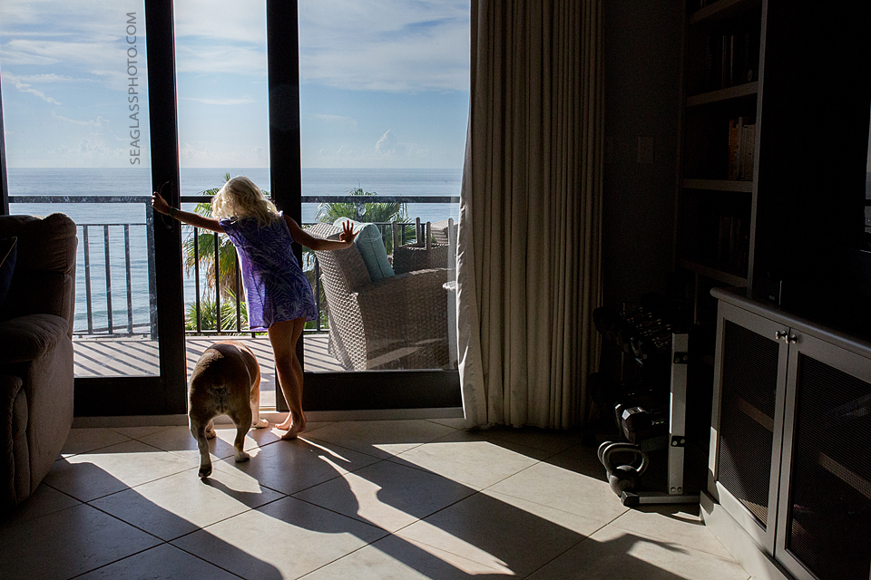girl letting dog outside in vero beach florida seaglass photography