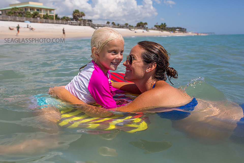 mom and daughter hanging out in the ocean