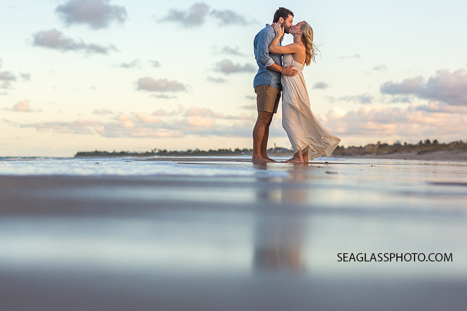 sunset beach photo of couple kissing in Vero Beach Florida