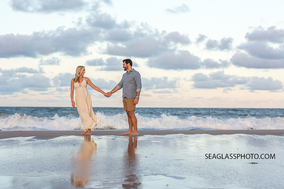 sunset beach photo of couple holding hands in Vero Beach Florida