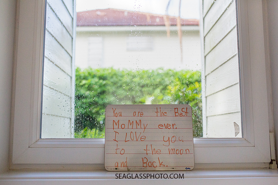 hand written sign from daughter to mother Vero Beach Florida Family Photography