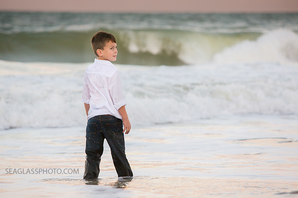 boy watching the waves at sunset in Vero Beach Florida family Photography
