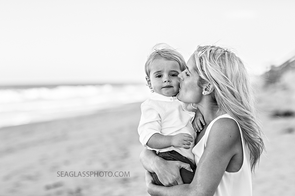 black and white photo of mom kissing her son's cheek Orchid Island Beach Club in Vero Beach Florida