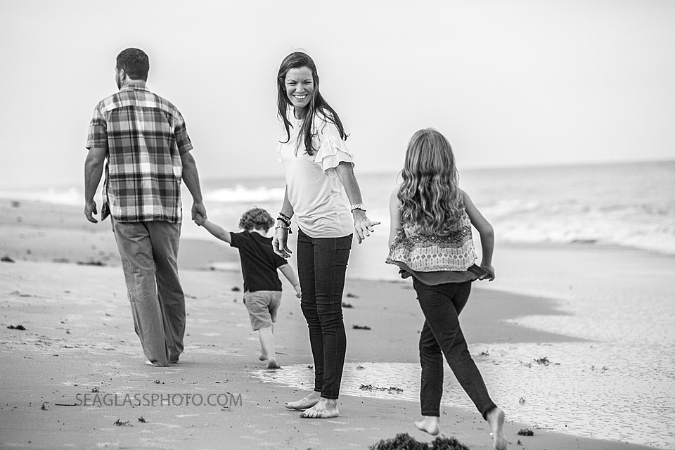 black and white photo of a family walking on the beach n Vero Beach Florida Family Photographer