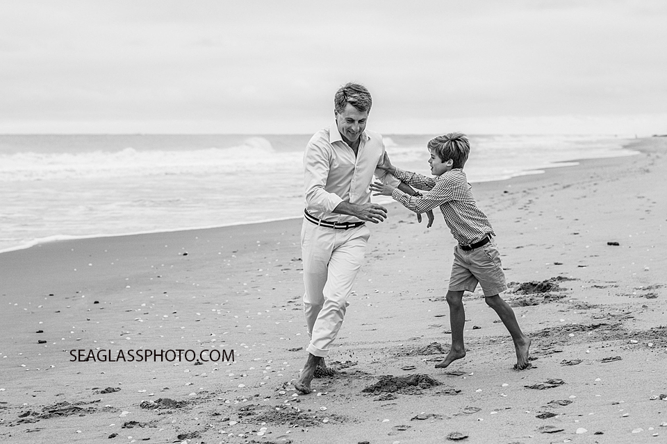 Black and white photo of father and son playing at Windsor Beach Club in Vero Beach Florida