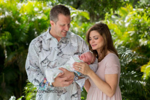 Mother and father admire their newborn daughter during the photo shoot in Vero Beach Florida