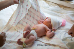 Baby Girl being wrapped in a hospital blanket after birth in Vero Beach Florida
