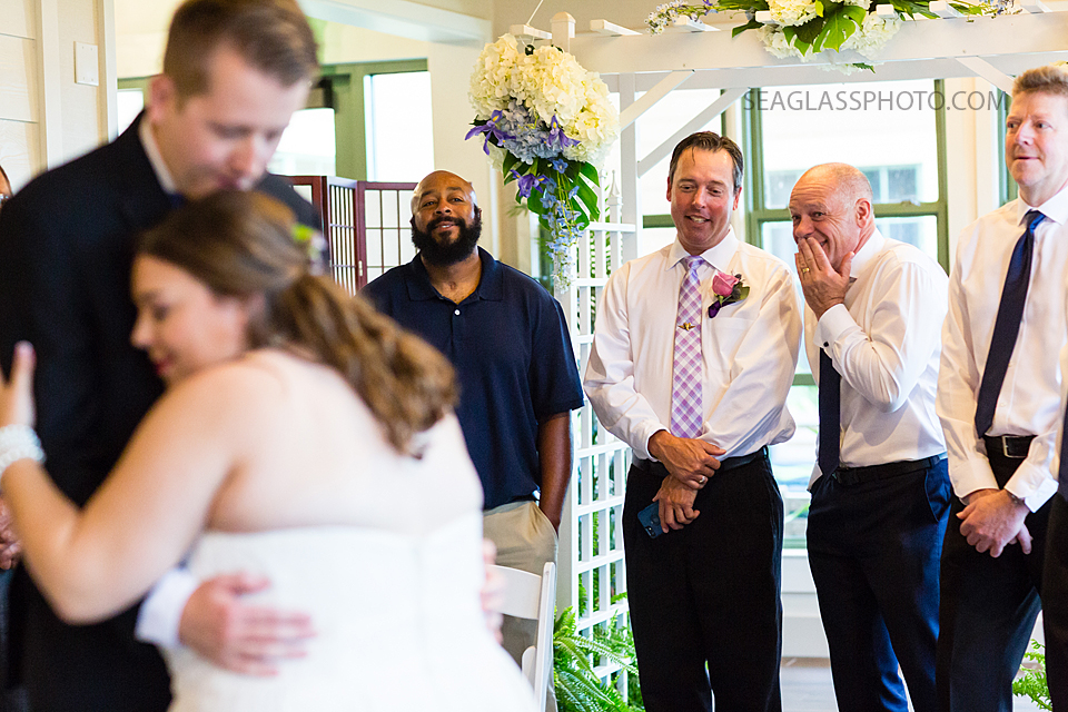 As the bride and groom dance together guest circle around and watch this happy moment after the wedding in Vero Beach Florida