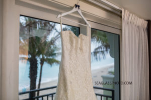Close up of the brides wedding dress before the wedding at the Kimpton Vero Beach hotel and spa in Vero Beach Florida