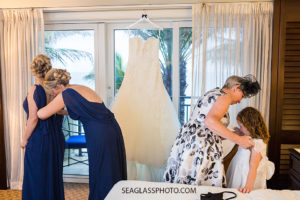 Everybody helping each other get ready for the wedding soon to come in Vero Beach Florida