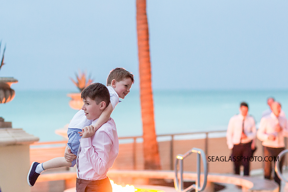 Two brothers playing outside at the Kimpton Vero Beach hotel and spa in Vero Beach Florida
