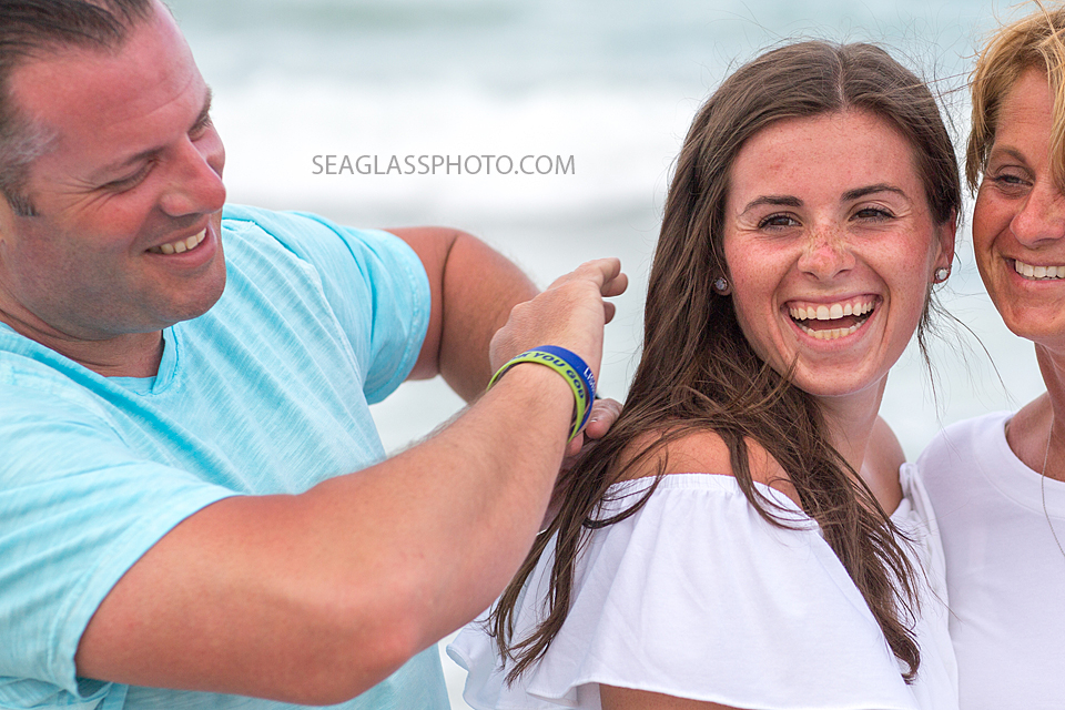Close up of a father getting rid of his daughters hiccups during family photos in Vero Beach Florida