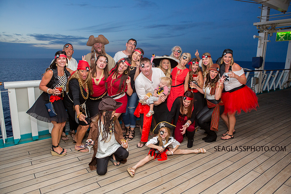 Family members dress up as pirates as the set for the sea on a cruise to the bahama's Photographed by a Vero Beach Florida Photographer