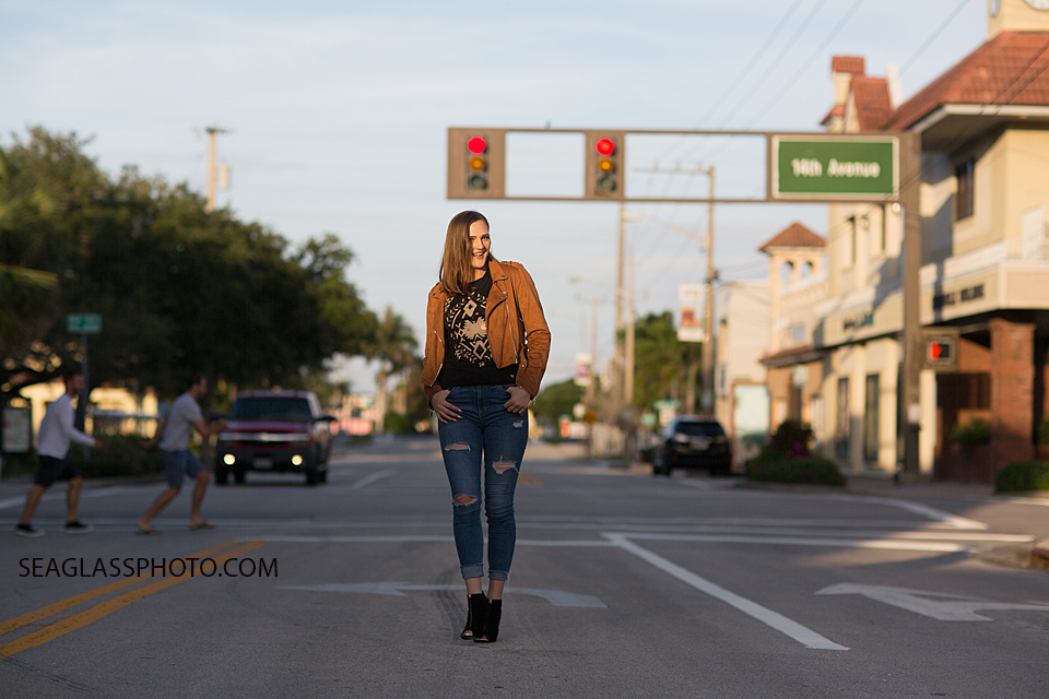 posing n the street for her senior pictures in Vero Beach Florida