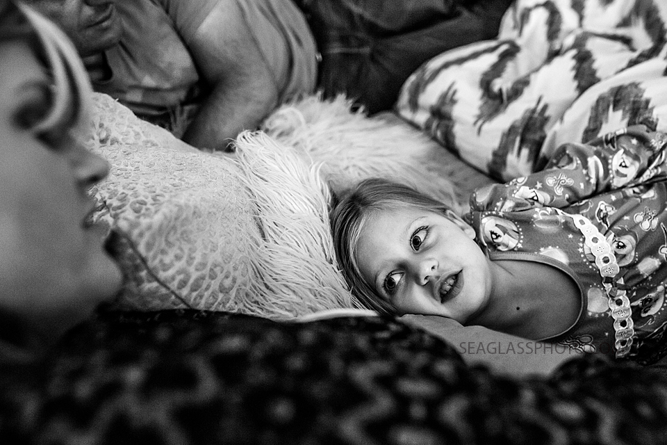 Black and white photo of mom and daughter talking during a home photo shoot in Vero Beach Florida
