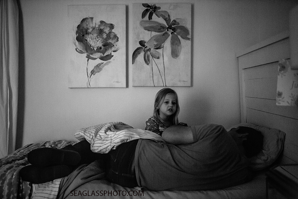 Black and white photo of daughter and father during a home photo shoot in Vero Beach Florida
