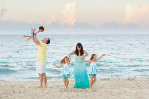 Family messes around on the beach during family photos in Vero Beach Florida